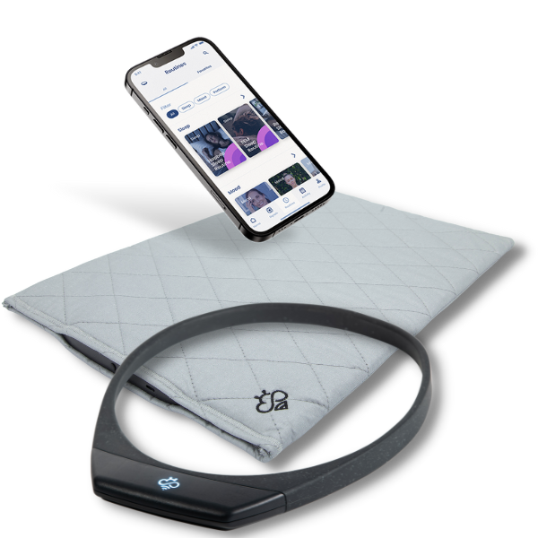 Hapbee Sleep Pad (gray quilted mat), black neckband device, and smartphone showing Hapbee app interface, styled together for better sleep and mood support.