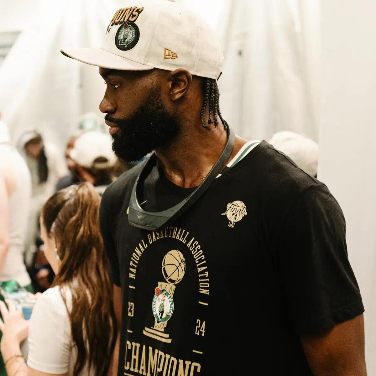 NBA Champion Jaylen Brown wears the Hapbee Neckband device