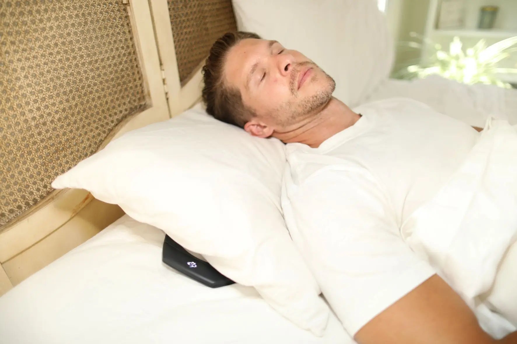 Hapbee Neckband being used to help a man fall asleep
