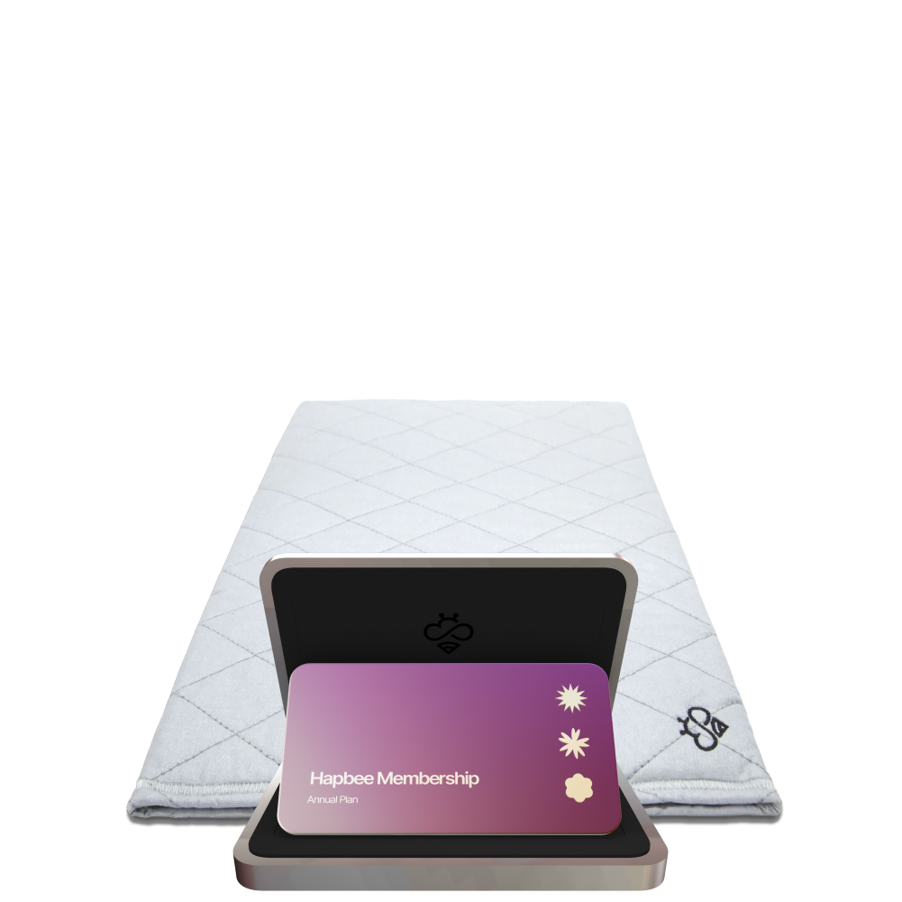 A sleep pad with a 'Hapbee Membership' card placed on top, indicating a subscription plan.